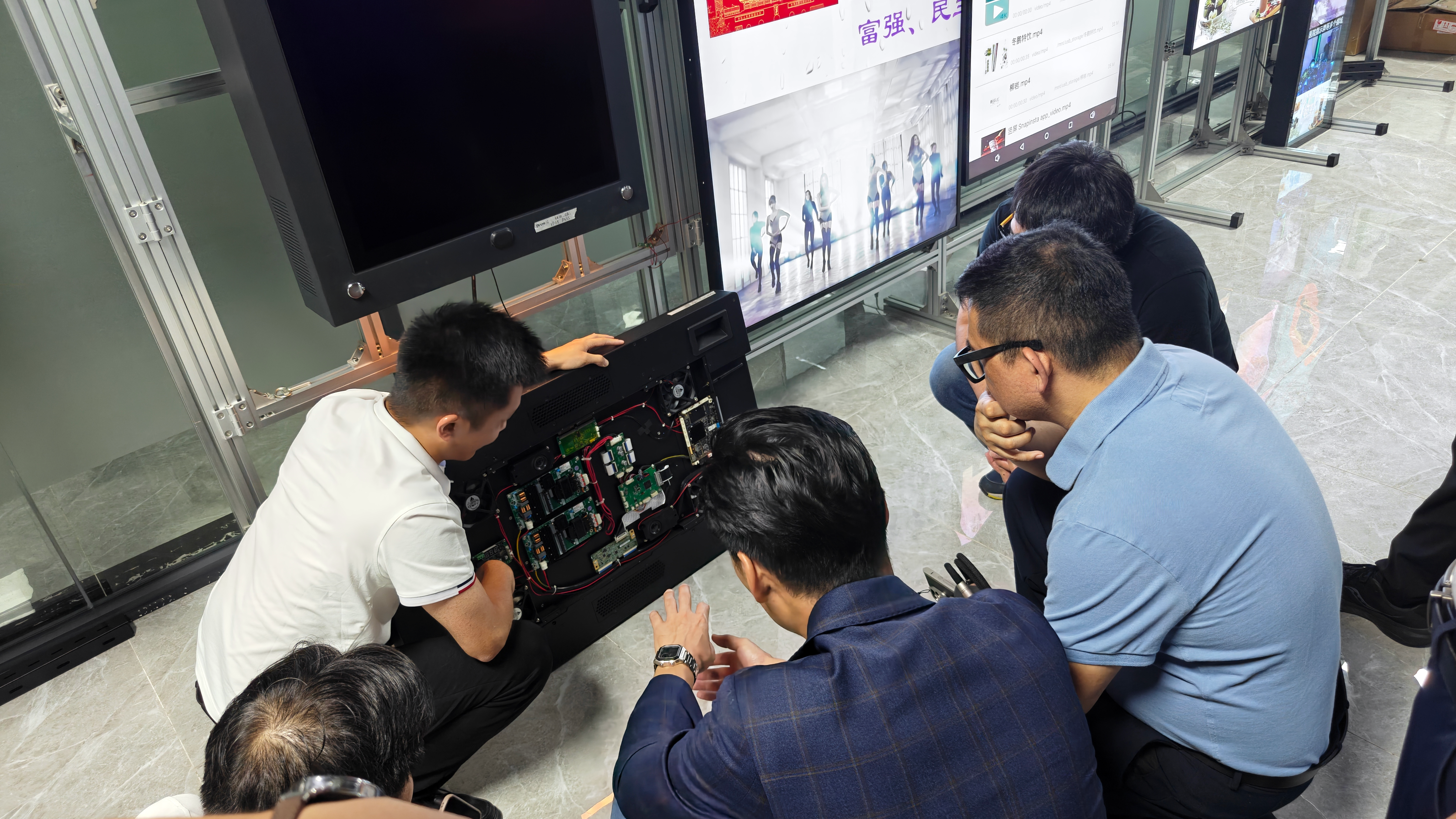Engineering review of an opened display housing and electronics; supplied photograph